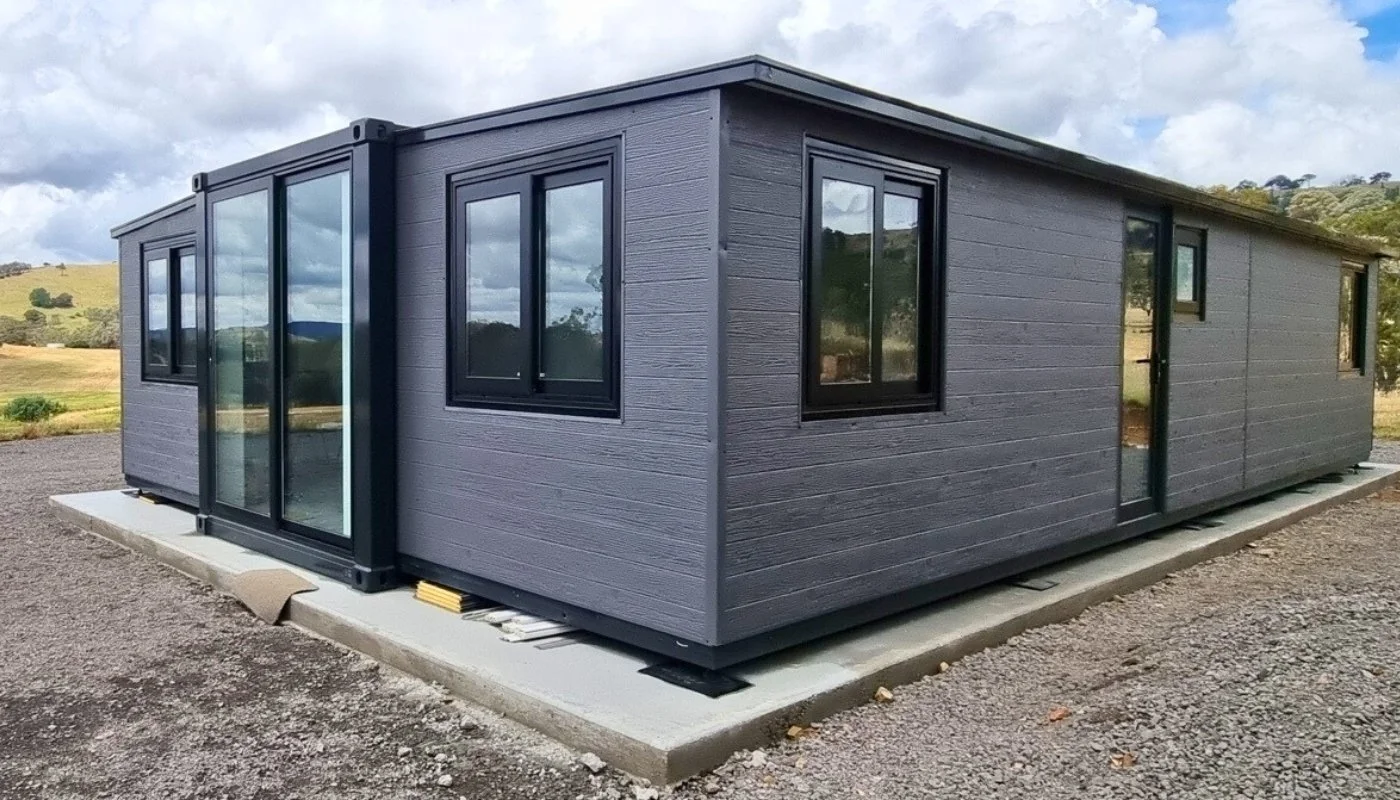 A modern black tiny home on a New Zealand section