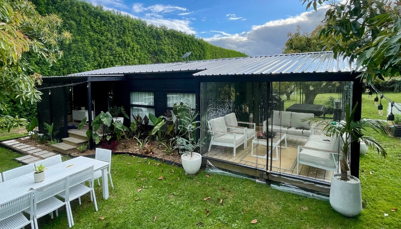 An expandable home with a covered outdoor area and tidy site works